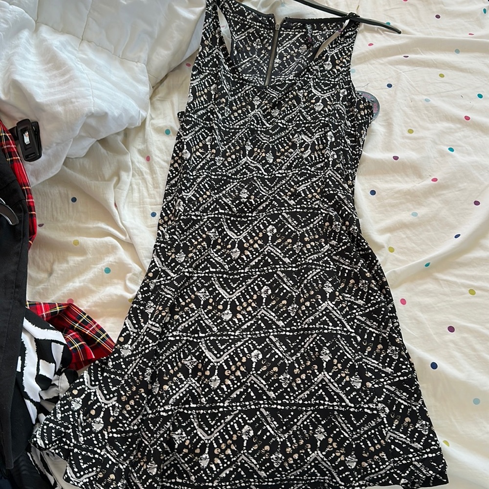 Size large be bop black dress with design.